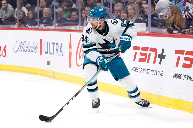 Feb 14, 2024; Winnipeg, Manitoba, CAN; San Jose Sharks Alexander Barabanov (94) skates with the puck in the second period against the Winnipeg Jets at Canada Life Centre. Mandatory Credit: James Carey Lauder-USA TODAY Sports