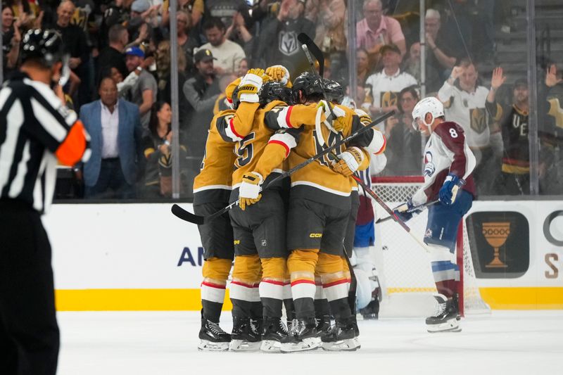 Oct 9, 2024; Las Vegas, Nevada, USA; The Vegas Golden Knights celebrate after scoring a goal against the Colorado Avalanche during the first period at T-Mobile Arena. Mandatory Credit: Lucas Peltier-Imagn Images