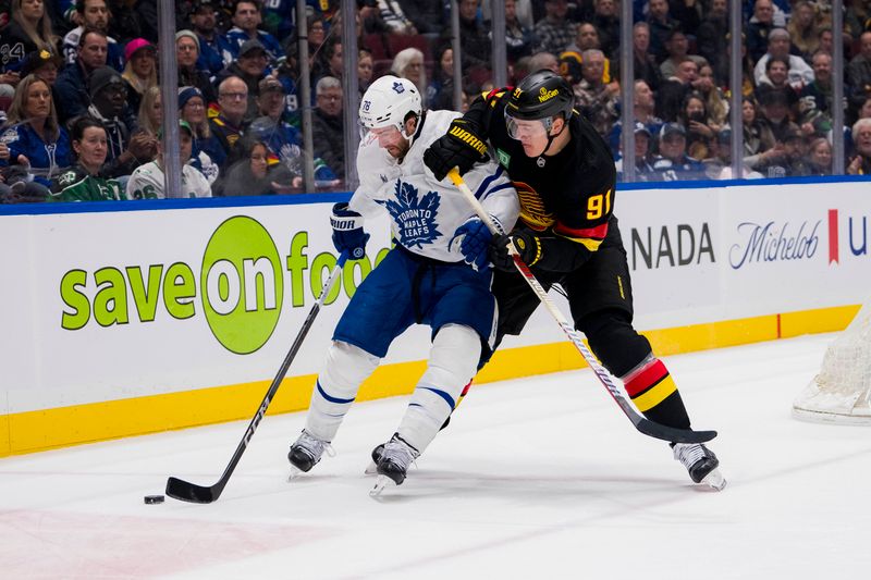 Jan 20, 2024; Vancouver, British Columbia, CAN; Vancouver Canucks defenseman Nikita Zadorov (91) checks Toronto Maple Leafs defenseman TJ Brodie (78) in the first period at Rogers Arena. Mandatory Credit: Bob Frid-USA TODAY Sports