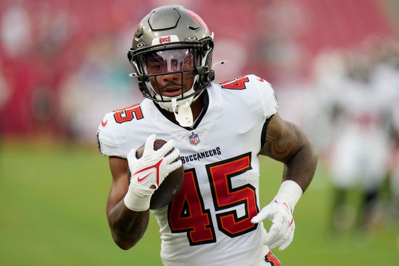 Tampa Bay Buccaneers running back Ramon Jefferson (45) warms up before a pre season NFL football game against the Miami Dolphins, Friday, Aug. 23, 2024, in Tampa, Fla. (AP Photo/Chris O'Meara)