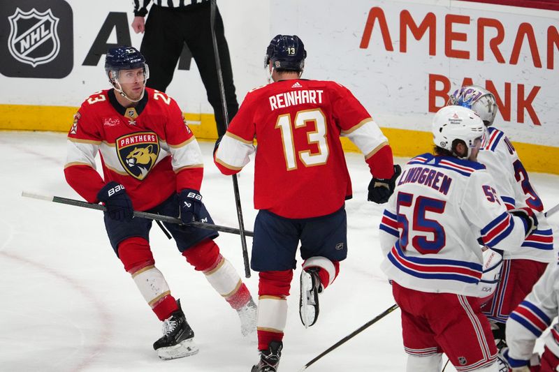 Dec 29, 2023; Sunrise, Florida, USA; Florida Panthers center Sam Reinhart (13) celebrates his goal against the New York Rangers with center Carter Verhaeghe (23) during the second period at Amerant Bank Arena. Mandatory Credit: Jasen Vinlove-USA TODAY Sports