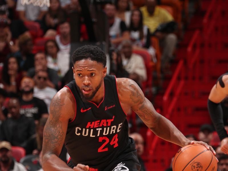 MIAMI, FL - APRIL 4: Haywood Highsmith #24 of the Miami Heat brings the ball up court during the game against the Philadelphia 76ers on April 4, 2024 at Kaseya Center in Miami, Florida. NOTE TO USER: User expressly acknowledges and agrees that, by downloading and or using this Photograph, user is consenting to the terms and conditions of the Getty Images License Agreement. Mandatory Copyright Notice: Copyright 2024 NBAE (Photo by Issac Baldizon/NBAE via Getty Images)