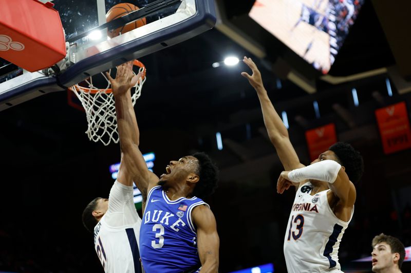 Feb 11, 2023; Charlottesville, Virginia, USA; Duke Blue Devils guard Jeremy Roach (3) shoots the ball as Virginia Cavaliers forward Kadin Shedrick (21) and Cavaliers guard Ryan Dunn (13) defend in the first half at John Paul Jones Arena. Mandatory Credit: Geoff Burke-USA TODAY Sports