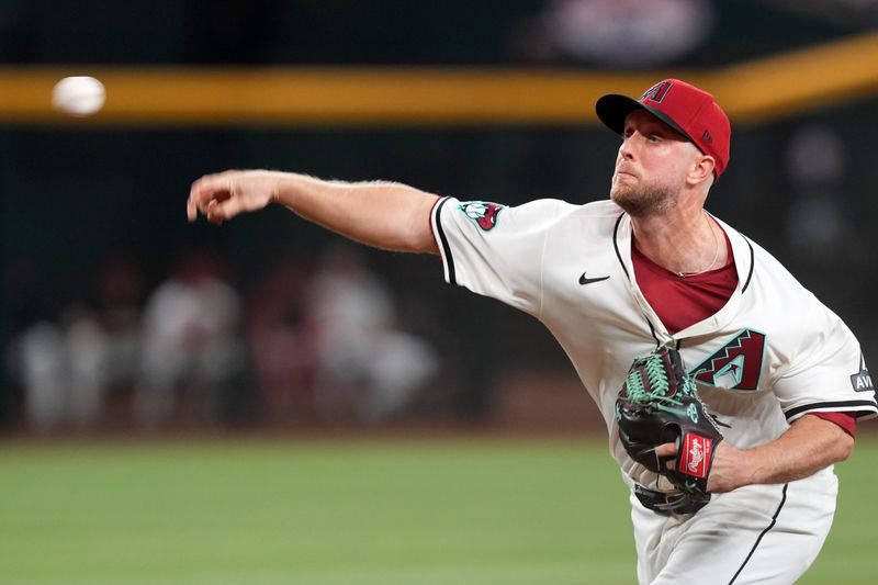 Sep 27, 2024; Phoenix, Arizona, USA; Arizona Diamondbacks pitcher Merrill Kelly (29) pitches against the San Diego Padres during the first inning at Chase Field. Mandatory Credit: Joe Camporeale-Imagn Images