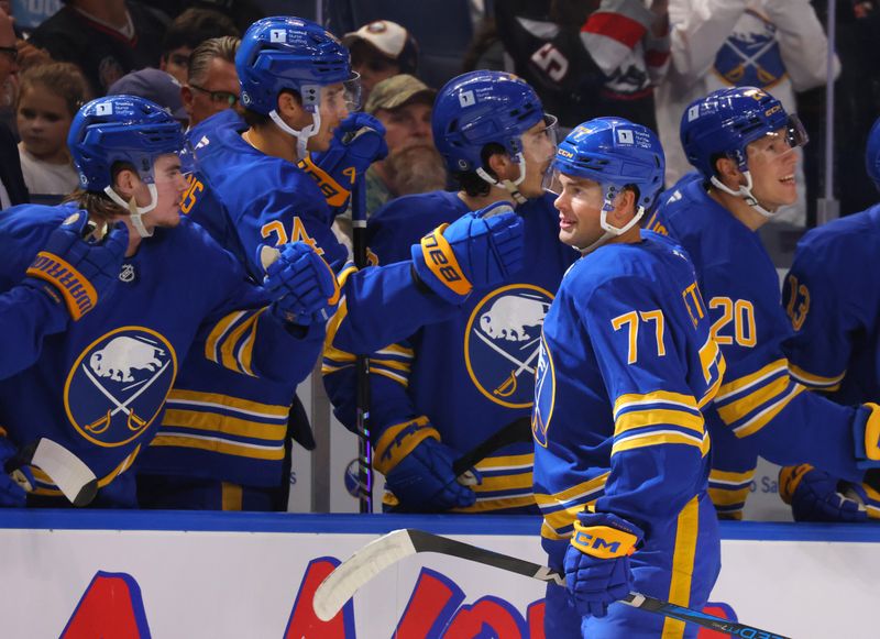 Sep 21, 2024; Buffalo, New York, USA;  Buffalo Sabres right wing JJ Peterka (77) celebrates his goal with teammates during the first period against the Pittsburgh Penguins at KeyBank Center. Mandatory Credit: Timothy T. Ludwig-Imagn Images