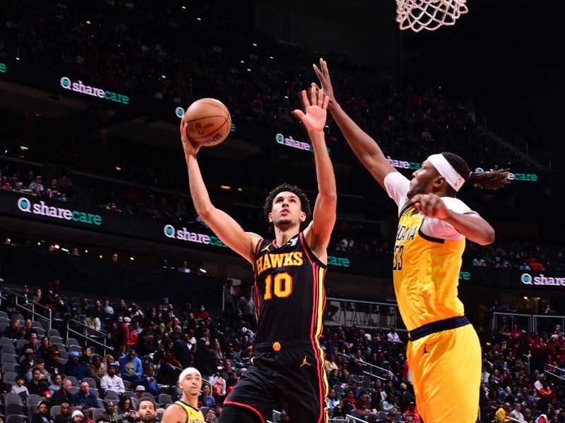 ATLANTA, GA - MARCH 6: Zaccharie Risacher #10 of the Atlanta Hawks drives to the basket during the game against the Indiana Pacers on March 6, 2025 at State Farm Arena in Atlanta, Georgia.  NOTE TO USER: User expressly acknowledges and agrees that, by downloading and/or using this Photograph, user is consenting to the terms and conditions of the Getty Images License Agreement. Mandatory Copyright Notice: Copyright 2025 NBAE (Photo by Adam Hagy/NBAE via Getty Images)