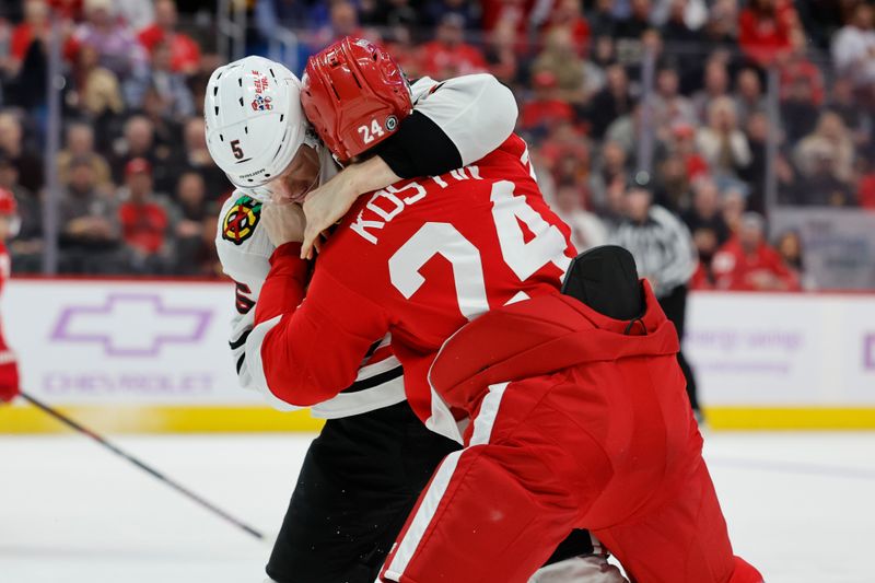 Nov 30, 2023; Detroit, Michigan, USA; Chicago Blackhawks defenseman Connor Murphy (5) and Detroit Red Wings center Klim Kostin (24) shove each other in the second period at Little Caesars Arena. Mandatory Credit: Rick Osentoski-USA TODAY Sports