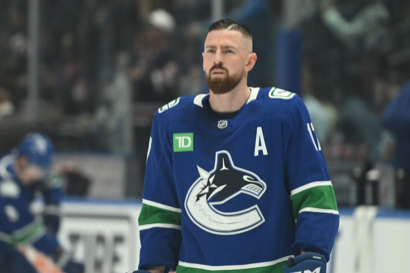 Feb 25, 2026; Vancouver, British Columbia, CAN;  Vancouver Canucks defenseman Filip Hronek (17) warms up prior to the game against the Winnipeg Jets at Rogers Arena. Mandatory Credit: Simon Fearn-Imagn Images