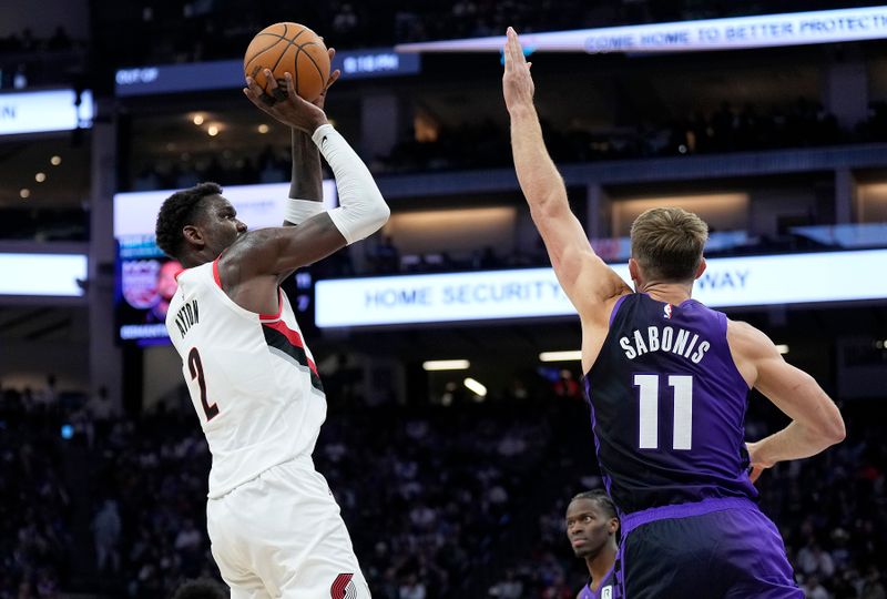 SACRAMENTO, CALIFORNIA - OCTOBER 28: Deandre Ayton #2 of the Portland Trail Blazers shoots over Domantas Sabonis #11 of the Sacramento Kings during the fourth quarter at Golden 1 Center on October 28, 2024 in Sacramento, California. NOTE TO USER: User expressly acknowledges and agrees that, by downloading and or using this photograph, User is consenting to the terms and conditions of the Getty Images License Agreement. (Photo by Thearon W. Henderson/Getty Images)