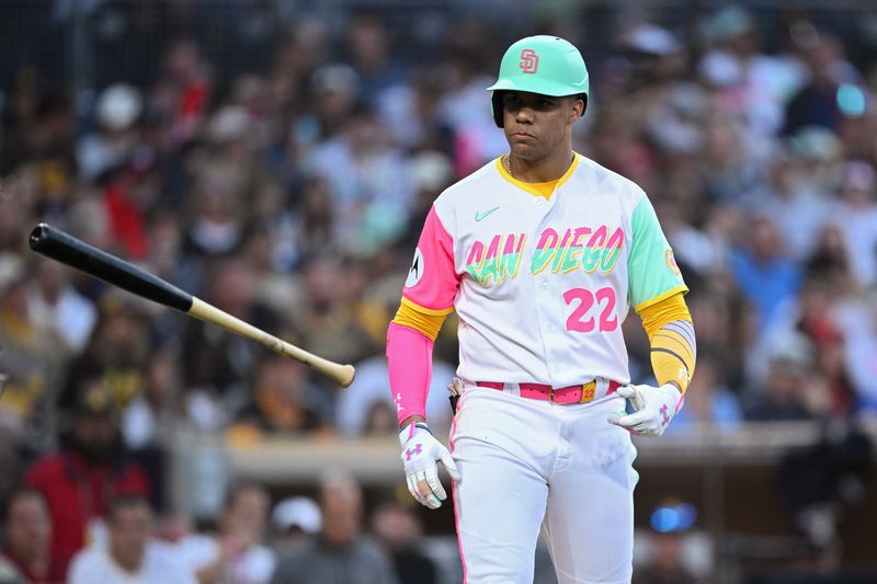 Jun 23, 2023; San Diego, California, USA; San Diego Padres left fielder Juan Soto (22) tosses his bat after a walk during the fourth inning against the Washington Nationals at Petco Park. Mandatory Credit: Orlando Ramirez-USA TODAY Sports