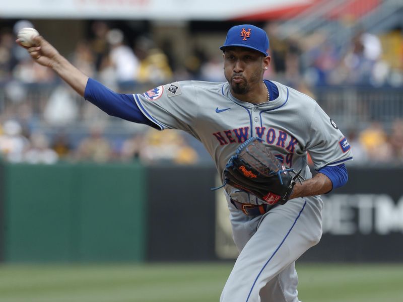 Jul 7, 2024; Pittsburgh, Pennsylvania, USA;  New York Mets relief pitcher Edwin Diaz (39) pitches against the Pittsburgh Pirates during the ninth inning at PNC Park. The Mets won 3-2. Mandatory Credit: Charles LeClaire-USA TODAY Sports