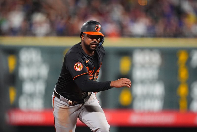 Aug 30, 2024; Denver, Colorado, USA; Baltimore Orioles designated hitter Eloy Jimenez (72) advances to third base in the sixth inning against the Colorado Rockies at Coors Field. Mandatory Credit: Ron Chenoy-USA TODAY Sports