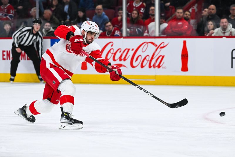 Dec 2, 2023; Montreal, Quebec, CAN; Detroit Red Wings defenseman Shayne Gostisbehere (41) shoots the puck during the second period at Bell Centre. Mandatory Credit: David Kirouac-USA TODAY Sports