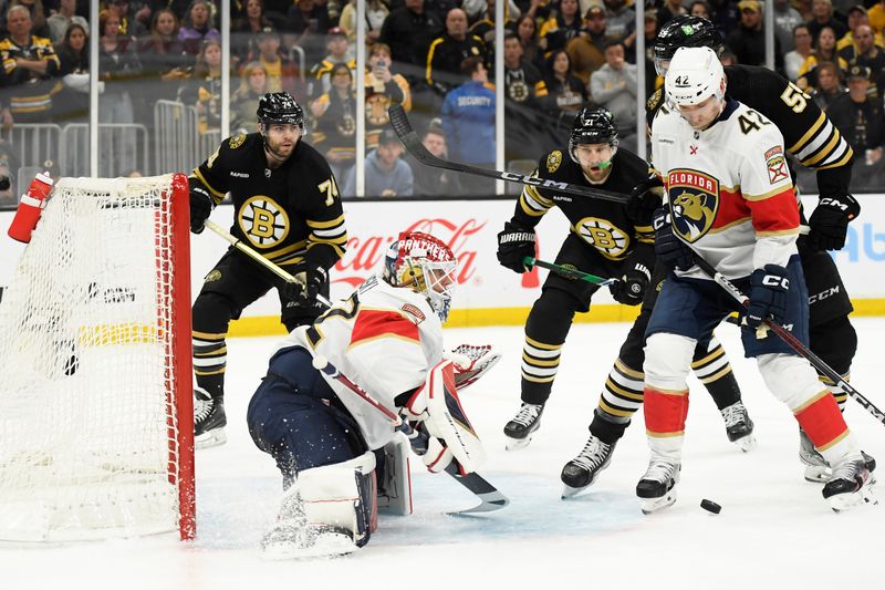 May 12, 2024; Boston, Massachusetts, USA; Florida Panthers defenseman Gustav Forsling (42) battles for the puck with Boston Bruins right wing Justin Brazeau (55) in front of goaltender Sergei Bobrovsky (72) during the third period in game four of the second round of the 2024 Stanley Cup Playoffs at TD Garden. Mandatory Credit: Bob DeChiara-USA TODAY Sports