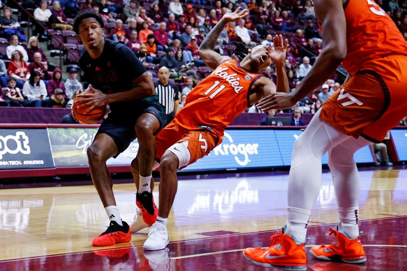 Jan 4, 2025; Blacksburg, Virginia, USA; Miami Hurricanes forward Brandon Johnson (2) drives to the basket against Virginia Tech Hokies guard Ben Hammond (11) during the second half at Cassell Coliseum. Mandatory Credit: Peter Casey-Imagn Images