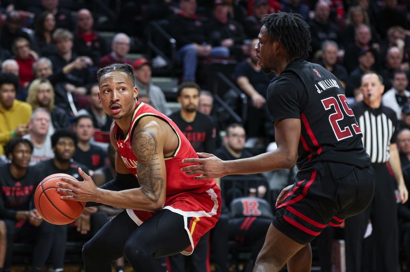 Feb 25, 2024; Piscataway, New Jersey, USA; Maryland Terrapins guard Jahmir Young (1) is guarded by Rutgers Scarlet Knights guard Jeremiah Williams (25) during the second half at Jersey Mike's Arena. Mandatory Credit: Vincent Carchietta-USA TODAY Sports