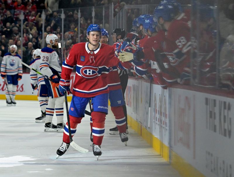 Nov 18, 2024; Montreal, Quebec, CAN; Montreal Canadiens defenseman Kaiden Guhle (21) celebrates with teammates after scoring a goal against the Edmonton Oilers during the third period at the Bell Centre. Mandatory Credit: Eric Bolte-Imagn Images