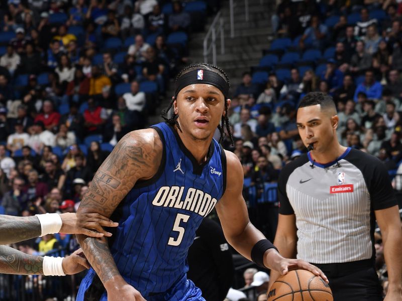 ORLANDO, FL - FEBRUARY 29: Paolo Banchero #5 of the Orlando Magic handles the ball during the game against the Utah Jazz on February 29, 2024 at Amway Center in Orlando, Florida. NOTE TO USER: User expressly acknowledges and agrees that, by downloading and or using this photograph, User is consenting to the terms and conditions of the Getty Images License Agreement. Mandatory Copyright Notice: Copyright 2024 NBAE (Photo by Fernando Medina/NBAE via Getty Images)