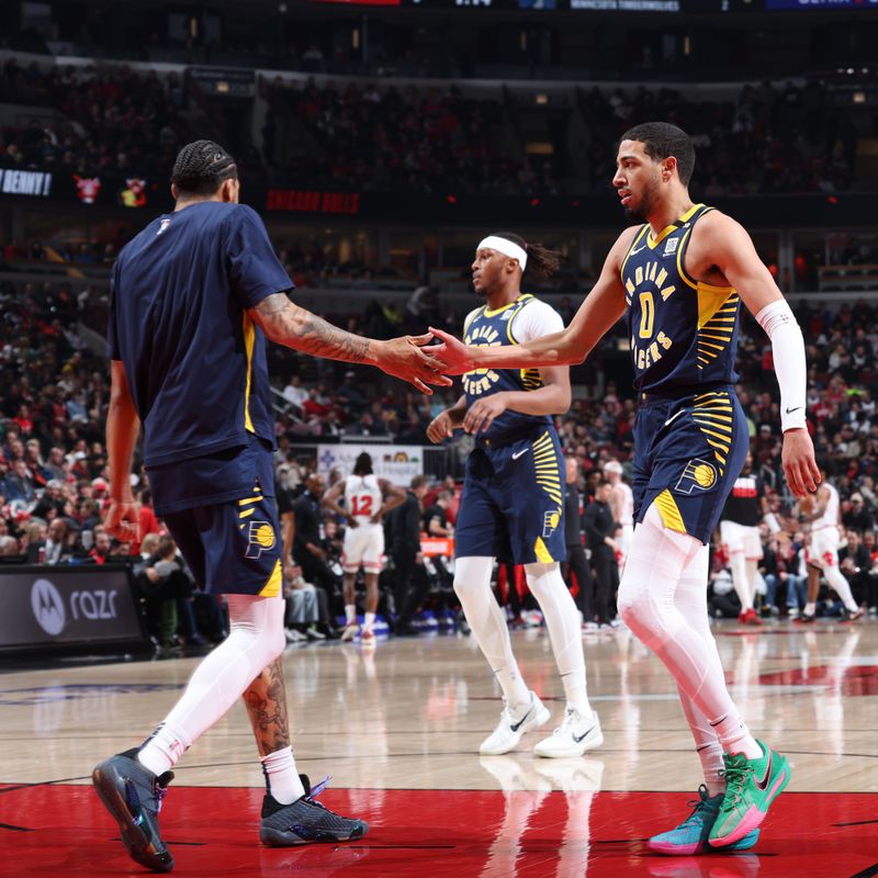 CHICAGO, IL - MARCH 27: Tyrese Haliburton #0 high fives Obi Toppin #1 of the Indiana Pacers during the game against the Chicago Bulls on March 27, 2024 at United Center in Chicago, Illinois. NOTE TO USER: User expressly acknowledges and agrees that, by downloading and or using this photograph, User is consenting to the terms and conditions of the Getty Images License Agreement. Mandatory Copyright Notice: Copyright 2024 NBAE (Photo by Jeff Haynes/NBAE via Getty Images)