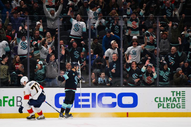 Dec 12, 2023; Seattle, Washington, USA; Seattle Kraken center Alex Wennberg (21) celebrates after scoring a goal against the Florida Panthers during the third period at Climate Pledge Arena. Mandatory Credit: Steven Bisig-USA TODAY Sports