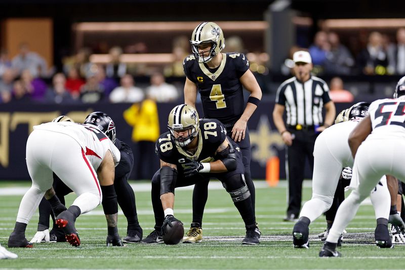 New Orleans Saints center Erik McCoy (78) and quarterback Derek Carr (4) during an NFL football game against the Atlanta Falcons, Sunday, Jan. 7, 2024, in New Orleans. (AP Photo/Tyler Kaufman)