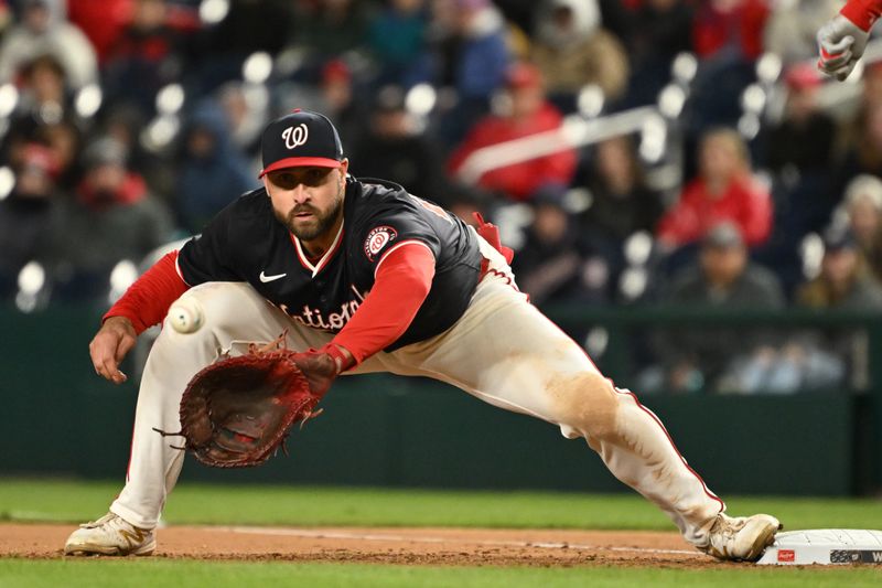 Apr 5, 2024; Washington, District of Columbia, USA; Washington Nationals first baseman Joey Gallo (24) catches the ball at first base for an out against the Washington Nationals during the seventh inning at Nationals Park. Mandatory Credit: Rafael Suanes-USA TODAY Sports