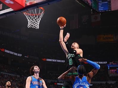 OKLAHOMA CITY, OK - JANUARY 2: Kristaps Porzingis #8 of the Boston Celtics drives to the basket during the game against the Oklahoma City Thunder on January 2, 2024 at Paycom Arena in Oklahoma City, Oklahoma. NOTE TO USER: User expressly acknowledges and agrees that, by downloading and or using this photograph, User is consenting to the terms and conditions of the Getty Images License Agreement. Mandatory Copyright Notice: Copyright 2024 NBAE (Photo by Zach Beeker/NBAE via Getty Images)