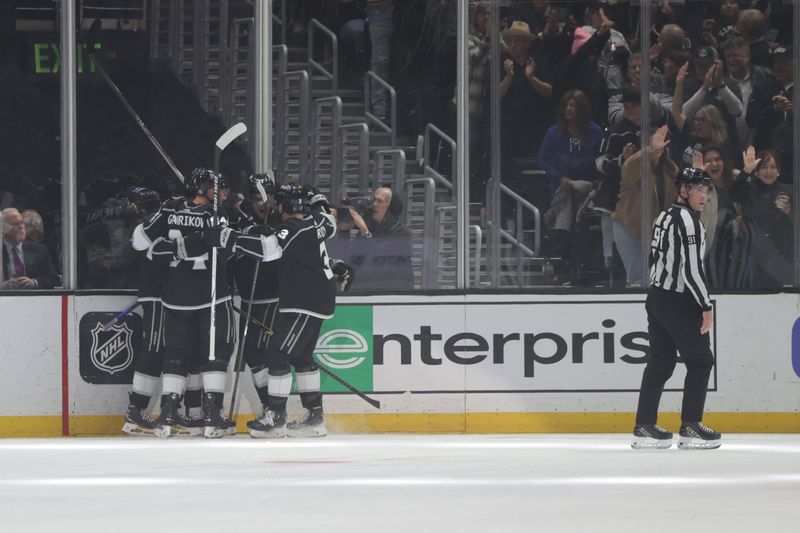 Mar 23, 2024; Los Angeles, California, USA; Members of the Los Angeles Kings celebrate after Los Angeles Kings right wing Adrian Kempe (9) scores a goal during the first period of an NHL hockey game against the Tampa Bay Lighting at Crypto.com Arena. Mandatory Credit: Yannick Peterhans-USA TODAY Sports