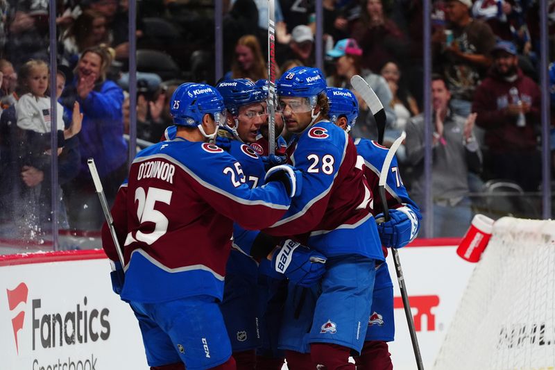 Oct 12, 2024; Denver, Colorado, USA; Colorado Avalanche left wing Miles Wood (28) celebrates with right wing Logan O'Connor (25) and center Parker Kelly (17) after scoring a goal against the Columbus Blue Jackets in the second period at Ball Arena. Mandatory Credit: Ron Chenoy-Imagn Images