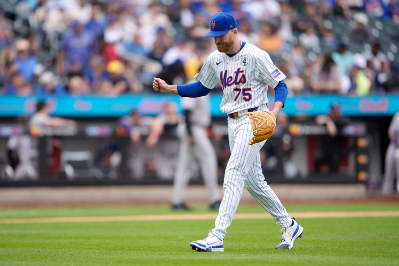 Jun 1, 2025; New York City, New York, USA; New York Mets pitcher Reed Garrett (75) reacts to getting a strikeout for the third out against the Colorado Rockies during the eighth inning at Citi Field. Mandatory Credit: Gregory Fisher-Imagn Images