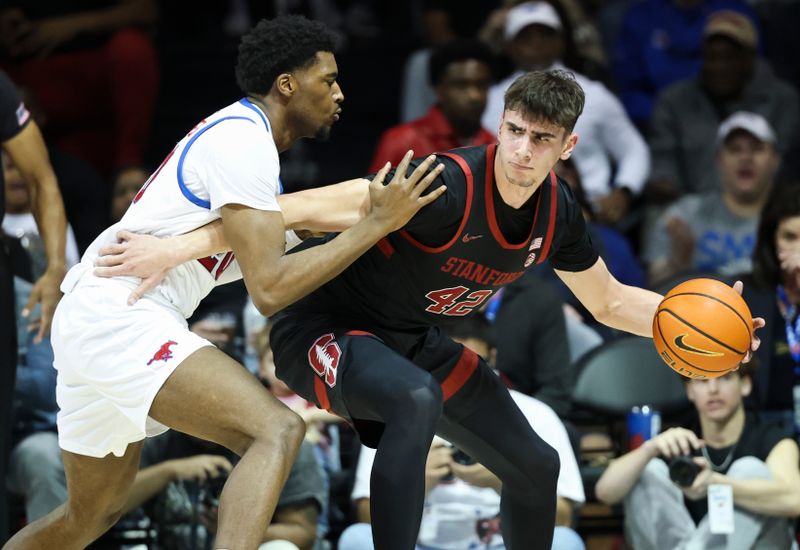 Feb 1, 2025; Dallas, Texas, USA;  Stanford Cardinal forward Maxime Raynaud (42) dribbles as Southern Methodist Mustangs forward Jerrell Colbert (20) defends during the first half at Moody Coliseum. Mandatory Credit: Kevin Jairaj-Imagn Images