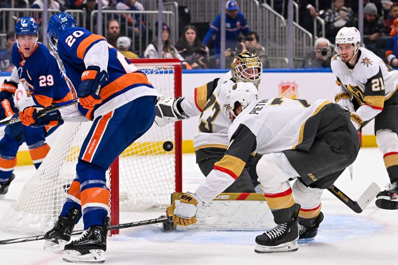 Jan 23, 2024; Elmont, New York, USA;  New York Islanders right wing Hudson Fasching (20) attempts a shot on Vegas Golden Knights goaltender Adin Hill (33) during the second period at UBS Arena. Mandatory Credit: Dennis Schneidler-USA TODAY Sports