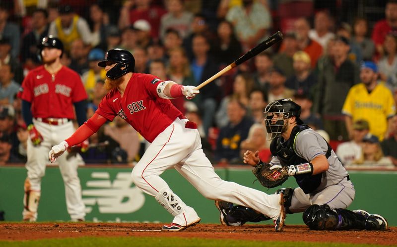 Jun 14, 2023; Boston, Massachusetts, USA; Boston Red Sox designated hitter Justin Turner (2) gets a base hit to drive in a run against the Colorado Rockies in the seventh inning at Fenway Park. Mandatory Credit: David Butler II-USA TODAY Sports