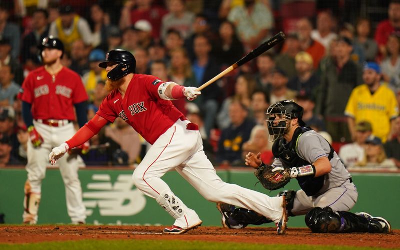 Jun 14, 2023; Boston, Massachusetts, USA; Boston Red Sox designated hitter Justin Turner (2) gets a base hit to drive in a run against the Colorado Rockies in the seventh inning at Fenway Park. Mandatory Credit: David Butler II-USA TODAY Sports