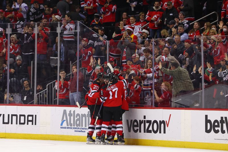 Dec 21, 2023; Newark, New Jersey, USA; New Jersey Devils center Dawson Mercer (91) celebrates his goal against the Edmonton Oilers during the first period at Prudential Center. Mandatory Credit: Ed Mulholland-USA TODAY Sports