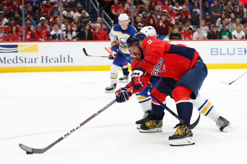 Nov 22, 2023; Washington, District of Columbia, USA; Washington Capitals left wing Alex Ovechkin (8) reaches for the puck in front of Buffalo Sabres defenseman Mattias Samuelsson (23) in the third period at Capital One Arena. Mandatory Credit: Geoff Burke-USA TODAY Sports