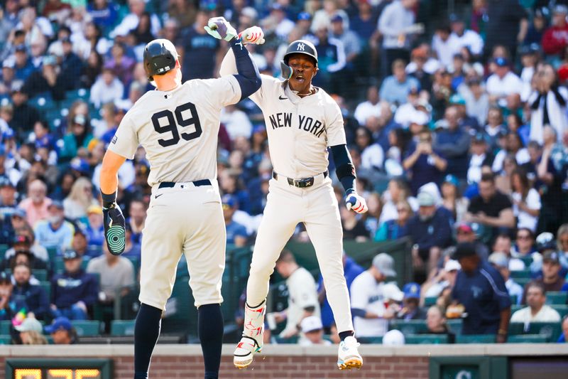 Sep 19, 2024; Seattle, Washington, USA; New York Yankees third baseman Jazz Chisholm Jr. (13) celebrates with center fielder Aaron Judge (99) after hitting a two-run home run against the Seattle Mariners during the third inning at T-Mobile Park. Mandatory Credit: Joe Nicholson-Imagn Images