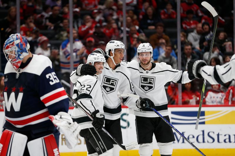 Jan 7, 2024; Washington, District of Columbia, USA; Los Angeles Kings left wing Kevin Fiala (22) celebrates with teammates after scoring a goal against the Washington Capitals during the third period at Capital One Arena. Mandatory Credit: Amber Searls-USA TODAY Sports