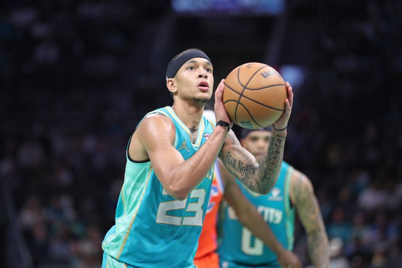 CHARLOTTE, NC - APRIL 7: Tre Mann #23 of the Charlotte Hornets shoots a free throw during the game against the Oklahoma City Thunder on April 7, 2024 at Spectrum Center in Charlotte, North Carolina. NOTE TO USER: User expressly acknowledges and agrees that, by downloading and or using this photograph, User is consenting to the terms and conditions of the Getty Images License Agreement.  Mandatory Copyright Notice:  Copyright 2024 NBAE (Photo by Brock Williams-Smith/NBAE via Getty Images)