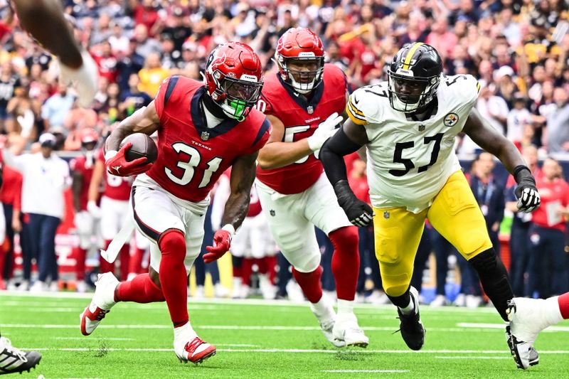 Houston Texans running back Dameon Pierce (31) runs the ball during the first quarter of an NFL football game against Pittsburg Steelers, Sunday, Oct. 1, 2023 in Houston, TX. (AP Photo/Maria Lysaker)