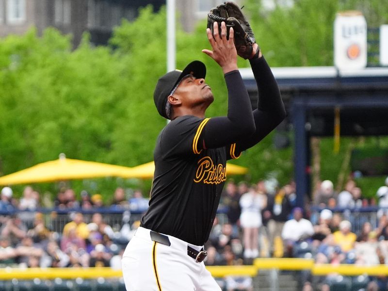 May 4, 2024; Pittsburgh, Pennsylvania, USA; Pittsburgh Pirates third baseman Ke'Bryan Hayes (13) catches a pop fly ball hit by Colorado Rockies designated hitter Charlie Blackmon (not pictured) during the second inning at PNC Park. Mandatory Credit: Gregory Fisher-USA TODAY Sports