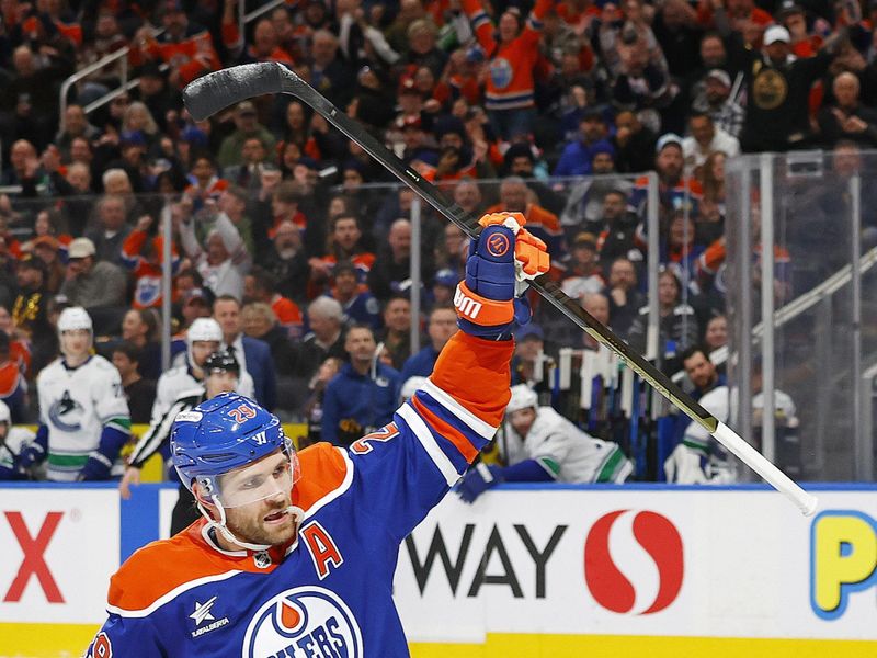 Jan 23, 2025; Edmonton, Alberta, CAN; Edmonton Oilers forward Leon Draisaitl (29) celebrates after scoring a goal against the Vancouver Canucks at Rogers Place. Mandatory Credit: Perry Nelson-Imagn Images