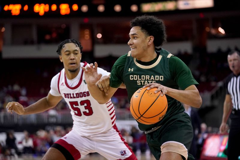 Feb 3, 2024; Fresno, California, USA; Colorado State Rams guard Jalen Lake (15) dribbles past Fresno State Bulldogs guard Xavier DuSell (53) in the second half at the Save Mart Center. Mandatory Credit: Cary Edmondson-USA TODAY Sports