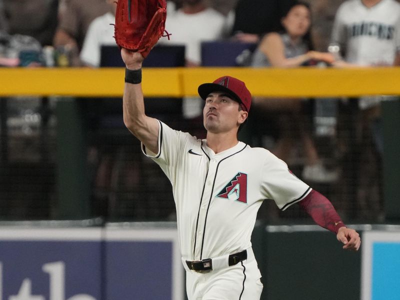 Jun 9, 2025; Phoenix, Arizona, USA; Arizona Diamondbacks outfielder Corbin Carroll (7) makes the running catch for an out against the Seattle Mariners in the fourth inning at Chase Field. Mandatory Credit: Rick Scuteri-Imagn Images