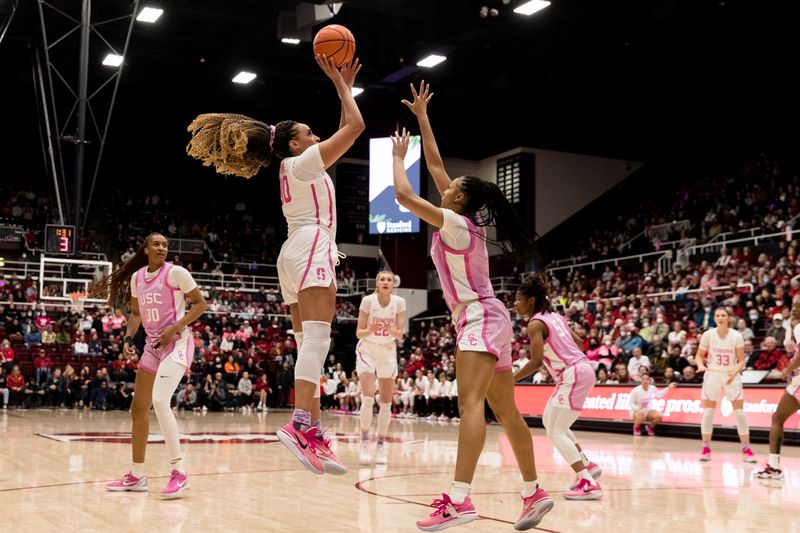 Feb 17, 2023; Stanford, California, USA;  Stanford Cardinal guard Haley Jones (30) shoots over USC Trojans guard Taylor Bigby (1) during the first half at Maples Pavilion. Mandatory Credit: John Hefti-USA TODAY Sports