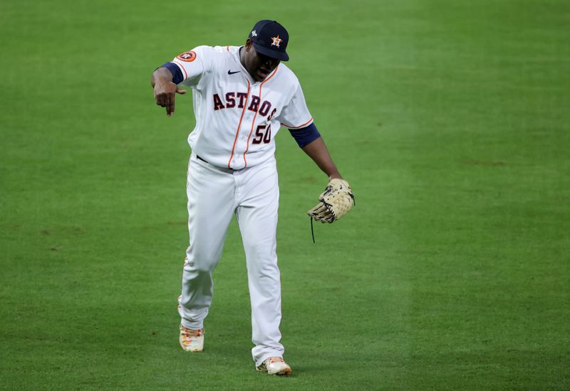 Oct 15, 2023; Houston, Texas, USA; Houston Astros pitcher Hector Neris (50) celebrates after the eighth inning of game one of the ALCS against the Texas Rangers in the 2023 MLB playoffs at Minute Maid Park. Mandatory Credit: Erik Williams-USA TODAY Sports