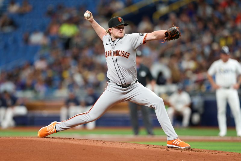 Apr 13, 2024; St. Petersburg, Florida, USA;  San Francisco Giants pitcher Logan Webb (62) throws a pitch against the Tampa Bay Rays in the first inning at Tropicana Field. Mandatory Credit: Nathan Ray Seebeck-USA TODAY Sports