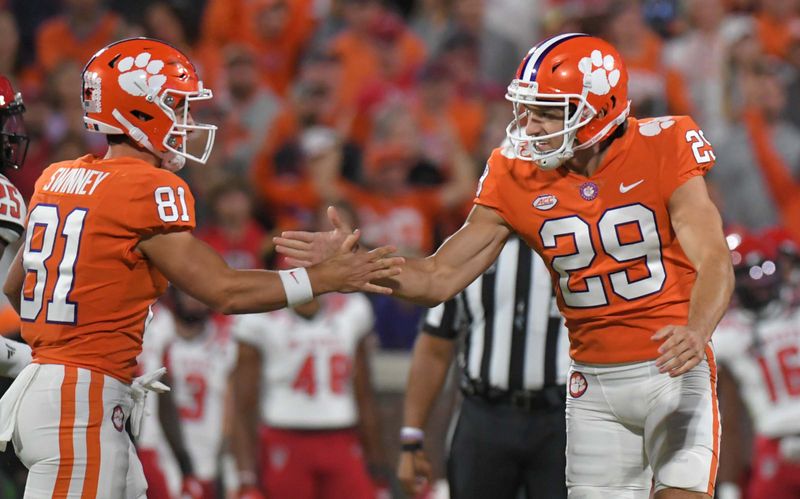 Oct 1, 2022; Clemson, South Carolina, USA;  Clemson kicker B.T. Potter (29) is congratulated after kicking a 44-yard field goal by wide receiver Drew Swinney (81) during the second quarter against NC State at Memorial Stadium. Mandatory Credit: Ken Ruinard-USA TODAY Sports