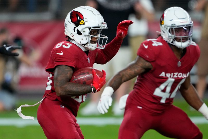 Arizona Cardinals wide receiver Greg Dortch (83) runs the ball against the Denver Broncos during the first half of an NFL preseason football game, Friday, Aug. 11, 2023, in Glendale, Ariz. (AP Photo/Matt York)