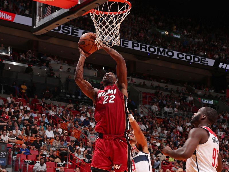 MIAMI, FL - MARCH 10: Jimmy Butler #22 of the Miami Heat drives to the basket during the game against the Washington Wizards on March 10, 2024 at Kaseya Center in Miami, Florida. NOTE TO USER: User expressly acknowledges and agrees that, by downloading and or using this Photograph, user is consenting to the terms and conditions of the Getty Images License Agreement. Mandatory Copyright Notice: Copyright 2024 NBAE (Photo by Issac Baldizon/NBAE via Getty Images)